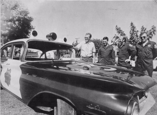 1973 Destruction Derby car with Yolo County Sheriff deputies. 