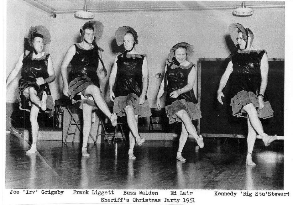1951 Yolo County deputy sheriffs, dressed as a chorus line, entertaining at the Sheriff's Christmas party.